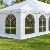 White cathedral tent sidewalls with large arched clear windows
