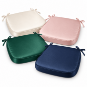 Satin Chiavari chair pads in ivory, blush pink, emerald green, and navy